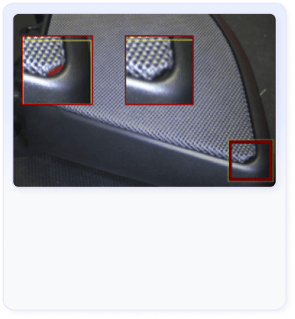 AI vision system detecting surface defects, scratches, cracks, and cosmetic imperfections on manufactured parts at production speeds