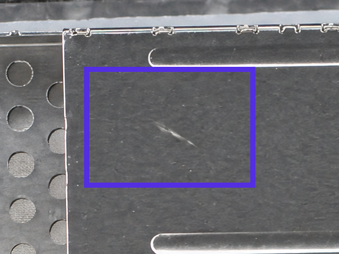Synthetic scratch on a 4-row cage assembly